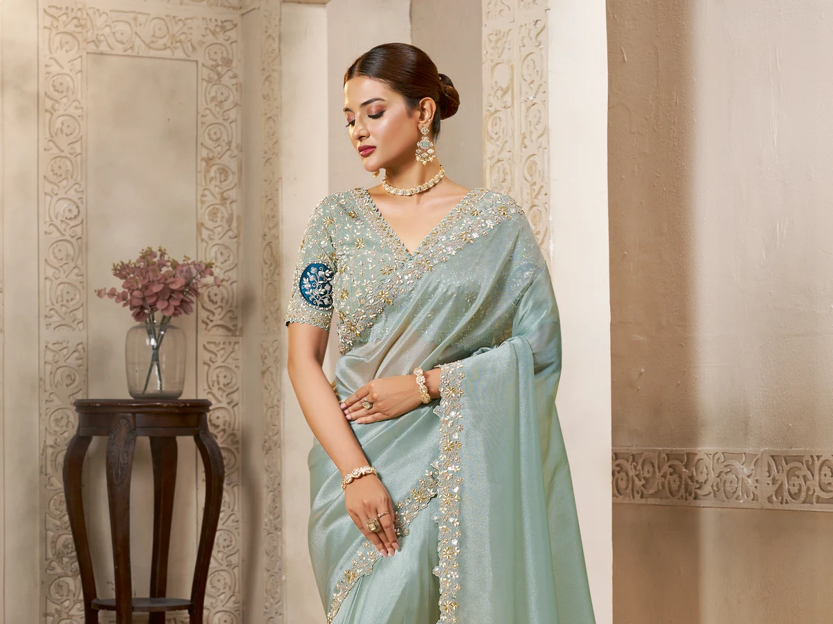 Model wearing a mint designer saree